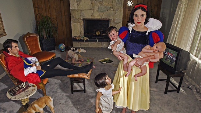Snow White doesn’t have the dwarfs to help keep up the house and to watch the kids. Meanwhile, her prince sips and snacks through a heated TV sports match.