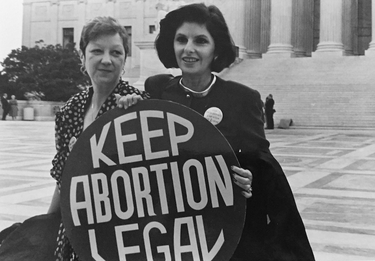 Norma McCorvey (aka Jane Roe) and lawyer Gloria Allred in front of the Supreme Court