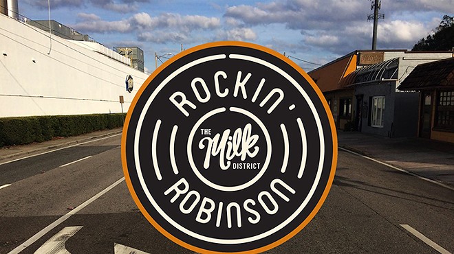 Milk District sets up the barricades for Rockin' Robinson music fest this Saturday