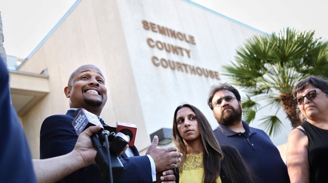 Carlos Leach, far left, and his client Minaz Mukhi-Skees, second-left, speak at a press conference at the Seminole County Courthouse.