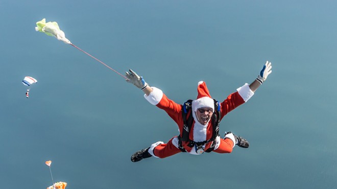 Watch a mass of skydiving Santas jump from planes onto Cocoa Beach this weekend