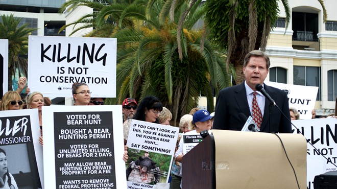 Chuck O'Neal, a member of Speak Up Wekiva who helped file a lawsuit against the Florida Fish & Wildlife Conservation Commission to stop the bear hunt, speaks at a rally on Sept. 24.