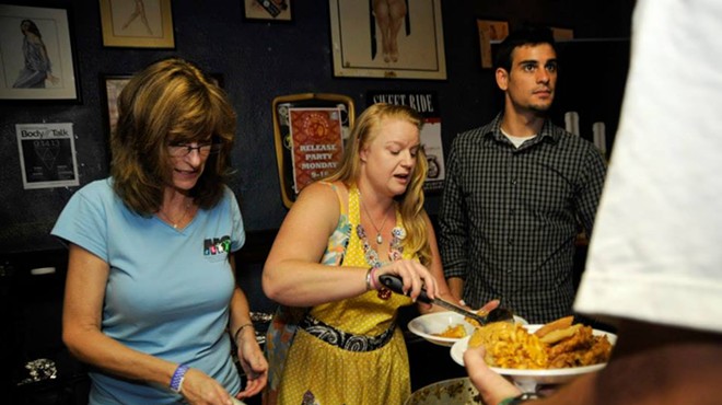 Pawli (center) serving food at the 2013 Benefit for Mustard Seed of Central Florida