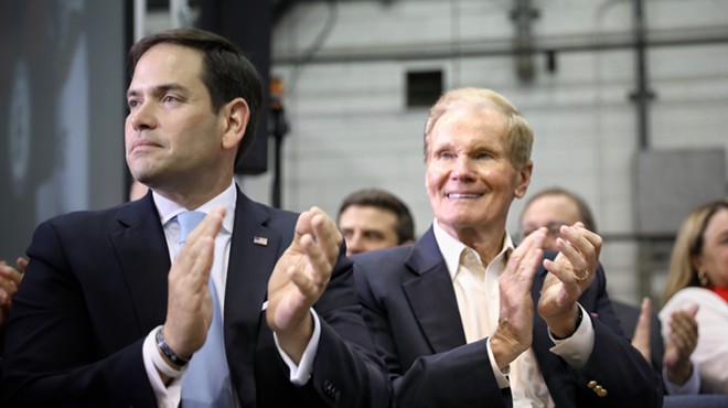 Sens. Bill Nelson and Marco Rubio applaud during a speech from Vice President Mike Pence at the Kennedy Space Center, Florida in 2017.