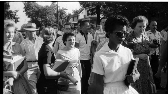 Elizabeth Eckford, 15, tries to enter Little Rock Central High School, Arkansas, in 1957 as she's pursued by a mob.