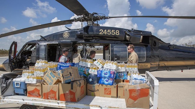 CBP AMO agents deliver food and water to Fox Town on the Abaco Islands in the Bahamas, Sept. 6 2019.