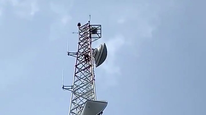 A man has climbed the TV broadcast tower at Orlando's WKMG channel 6