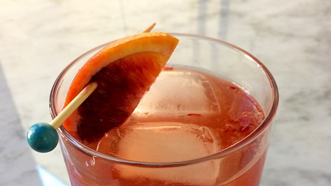 Our take on the Dubonnet Fizz fortifies the classic recipe with the punch of mezcal