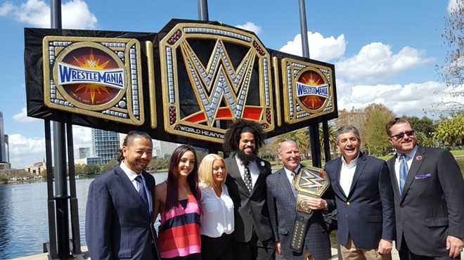 Mayor Buddy Dyer unveils giant WrestleMania title belt at Lake Eola