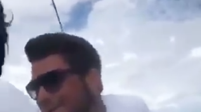 Florida idiots film themselves dragging live shark behind boat