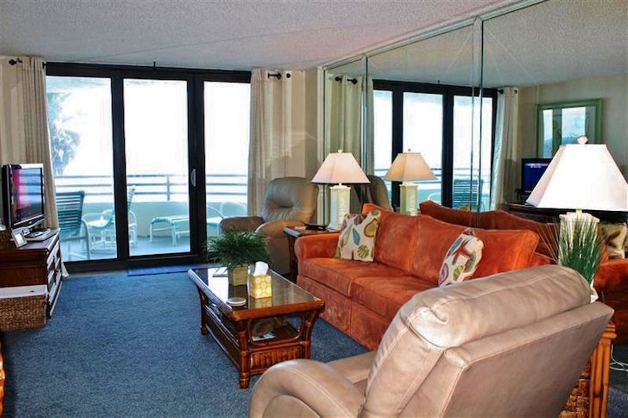  Check out this well-situated condo near Daytona International Speedway
Average night $167 
2 bedrooms
The condo comes with three, count em', three tvs, so you can all watch your shows while isolated in different rooms at the same time.