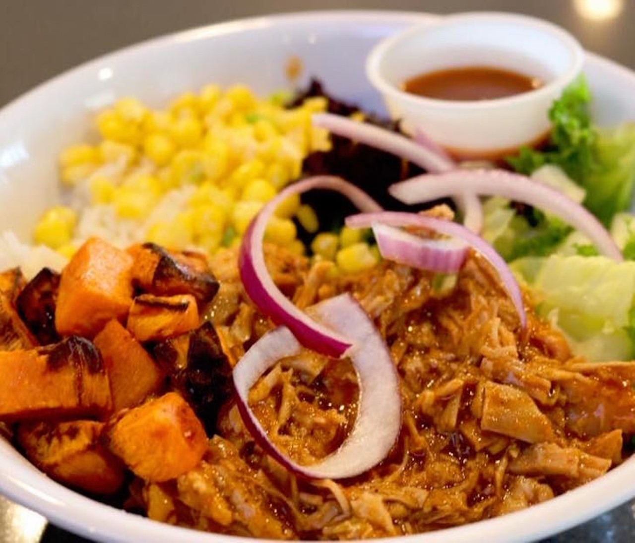 Must  try: The sweet potato and pineapple BBQ sauce Luau Pork bowl is one of Too Much Sauce&#146;s more savory options for when you want to pig out and eat healthy.
Photo via sauceorlando/Instagram