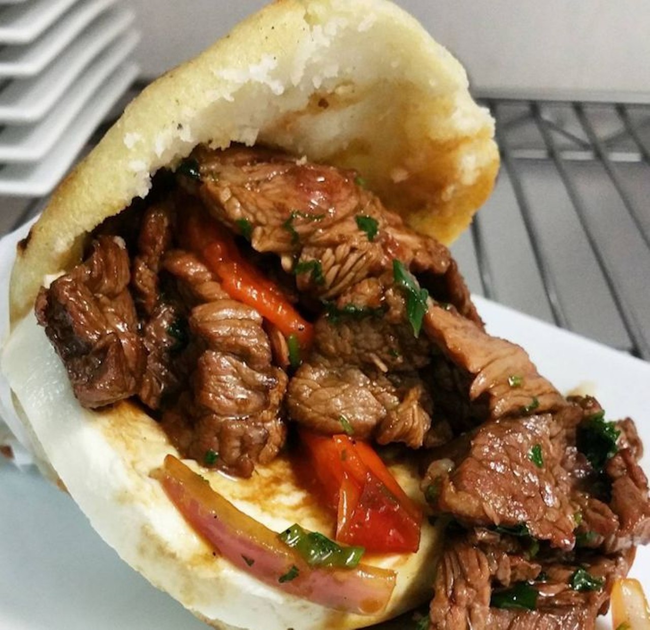 Must  try: Satisfy your Latin-food cravings with thick, crispy arepas stuffed with flavorful beef. 
Photo via bocasgrill//Instagram
