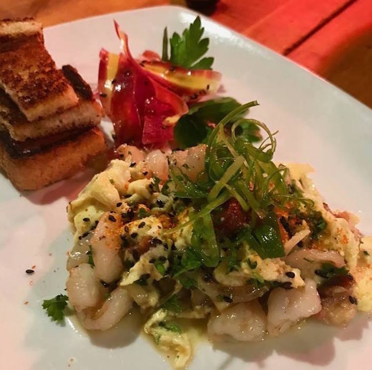 Try the Shrimp Revoltillo with Slab Bacon during their brunch hour. Perfect for a quick bite. 
Photo via El Buda via Facebook