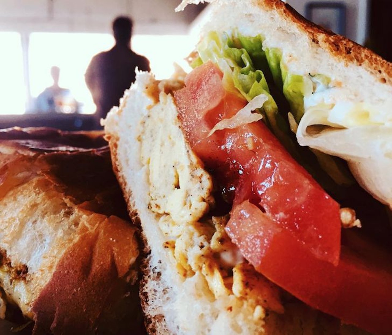 Try the jerk seasoned scrambled egg cuban lettuce, tomato, and mayo sandwich. 
Photo via iron_cow_cafe/Instagram