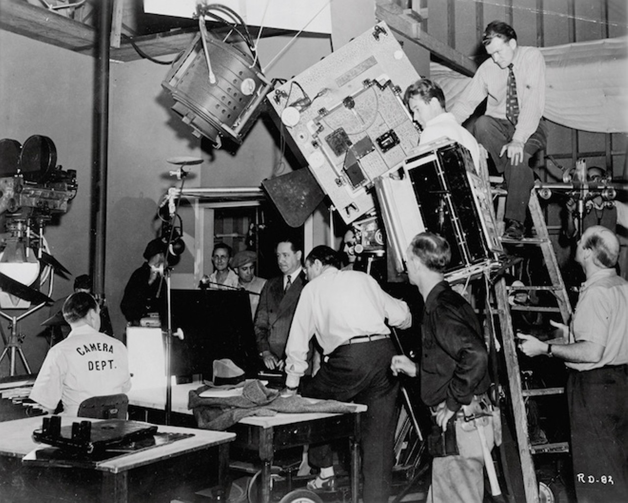 A Schultheis photo of Robert Benchley (center, in necktie) preparing to shoot a scene in The Reluctant Dragon (1941). Image courtesy of Walt Disney Archives
