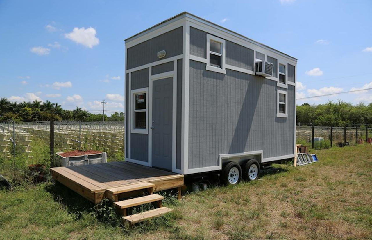 New Tiny House
Location: Loxahatchee
Price: $27,499
Size: 212 sq. ft.
This home on-the-go features two floors perfect for a family with one child who just love the thrill of traveling and being on the road. It comes with the unattached deck, dual propane tanks and instant hot water.