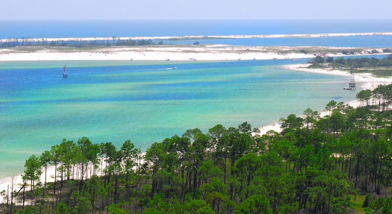 Perdido Key
Estimated driving distance from Orlando: 6 hours and 45 minutes 
Perdido Key, located in the Florida Panhandle, overlooks the Gulf and is lined with white sand dunes. Known as the &#147;Lost Island&#148;, this beach is alcohol-friendly, with the exception of glass containers, and home to abundant wildlife and estuaries. 
Photo via Adobe
