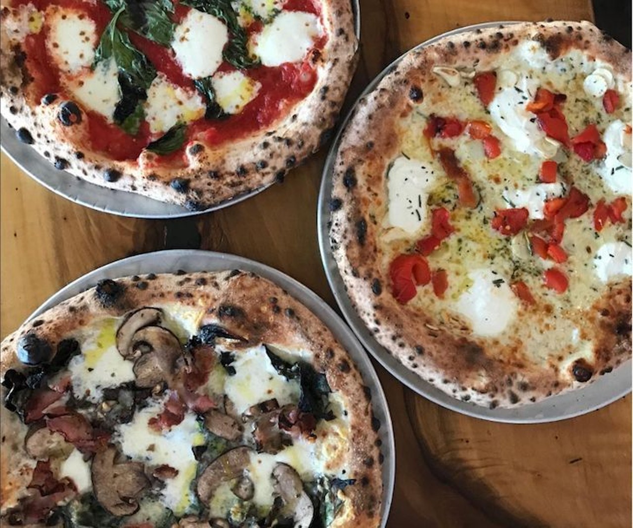 Pizza from Pizza Bruno 
3990 Curry Ford Road 
There are a lot of pizza joints in the city, but no one offers wood-fire Neapolitan style pies like Pizza Bruno. With a variety of toppings, their crunchy, cheesy slices are worth a visit. 
Photo via Pizza Bruno/Instagram