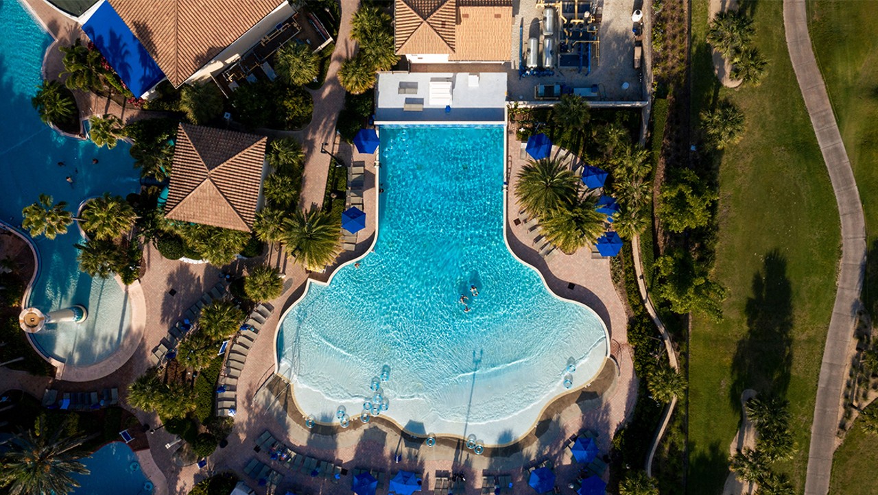 Omni Orlando Resort
1500 Masters Blvd, ChampionsGate, 407-360-6664 
$15-$200
This resort has Orlando’s only resort wave pool and even features a 125- foot corkscrew waterslide. If you are tired of hopping over strollers at the family-friendly theme parks, there is also an adults only pool to relax in. Other activities included a lazy river, arcade room, and even a tennis court. . For $200, you and three others can have access to all the fun amenities and a shaded cabana with a flat screen TV and a mini fridge.