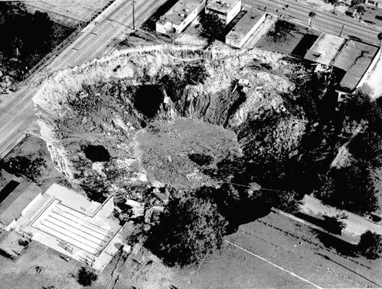 A sinkhole swallowed an entire block of Winter Park, including cars on a car lot and a house, in 1981. Now, the area is just a small lake located west of Denning Drive and north of Fairbanks Avenue.
Photo via Florida Memory
