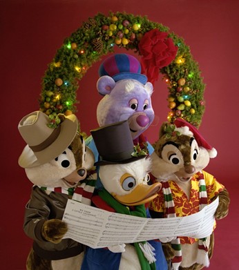 Chip, Dale, Scrooge McDuck and Zummi Gummi were making seasons bright in this 1990 caroling shot.Image via Walt Disney World Resort