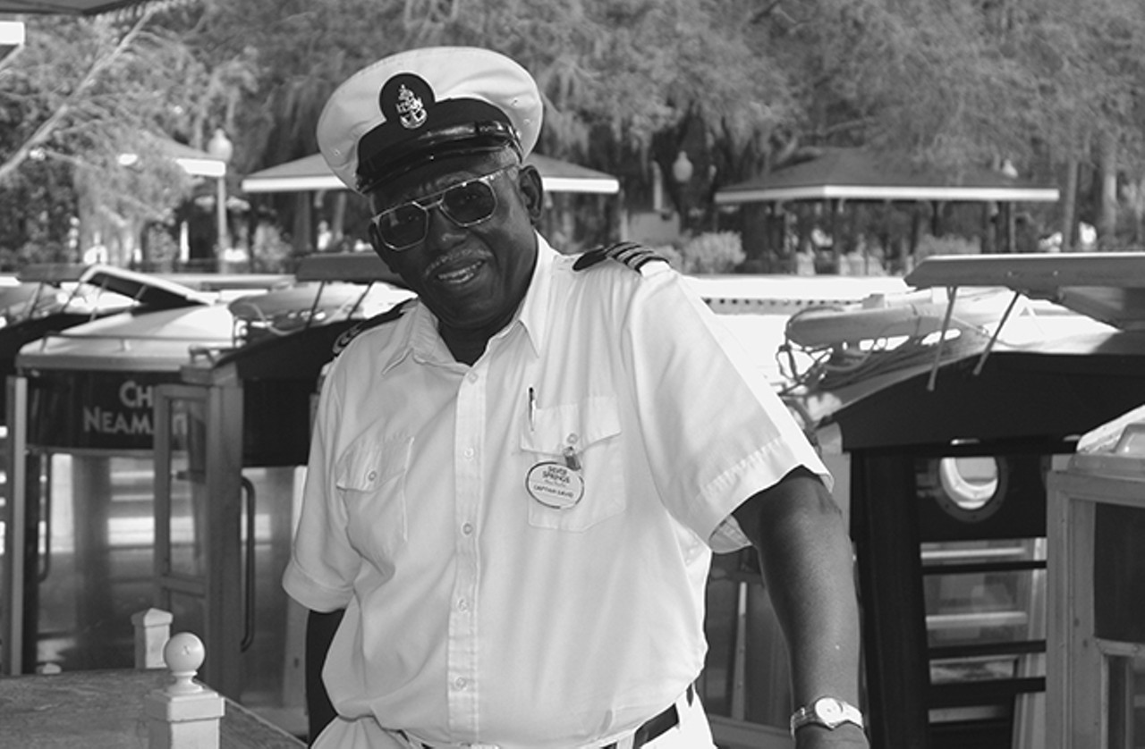 Boat captain David Faison poses for a picture after returning from taking visitors for a ride down the Silver River. After fifty-nine years at the springs, he still enjoys visitors and the history of the springs. Photo by Cynthia Wilson-Graham. By permission of Cynthia Wilson-Graham. Reprinted with permission by the University Press of Florida.