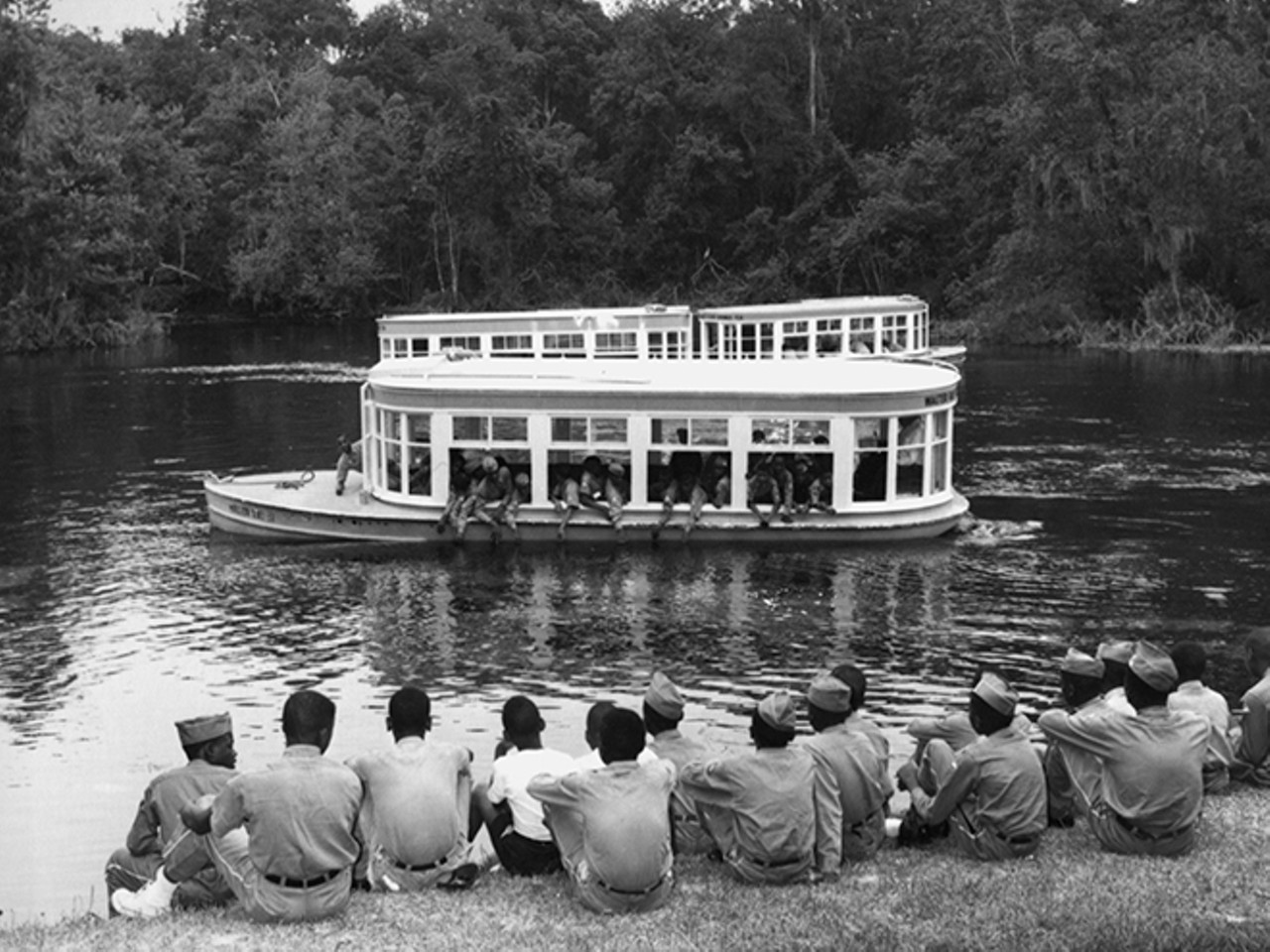 A group of scouts watch their friends feeding the fish from the glass bottom boat. Photo by Bruce Mozert. By permission of Bruce Mozert. Courtesy of Marion County Black Archives. Reprinted with permission of the University Press of Florida.