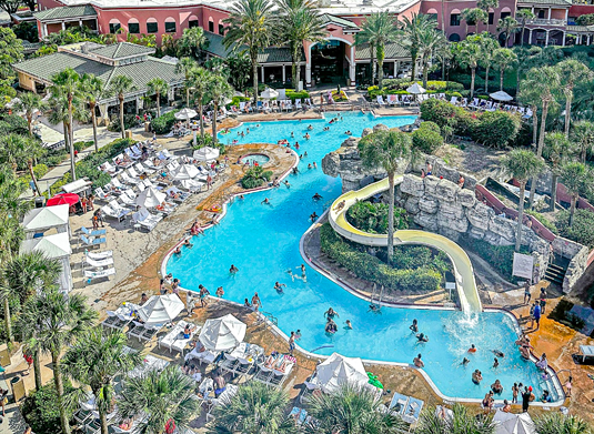 Caribe Royale Orlando
8101 World Center Drive, Orlando
$45-$125
With the purchase of a day pass here you’ll get discounted parking and access to the large resort-style pool and waterslide. And if you get lucky, there are some lounge chairs that sit below a cave with a view of a waterfall.