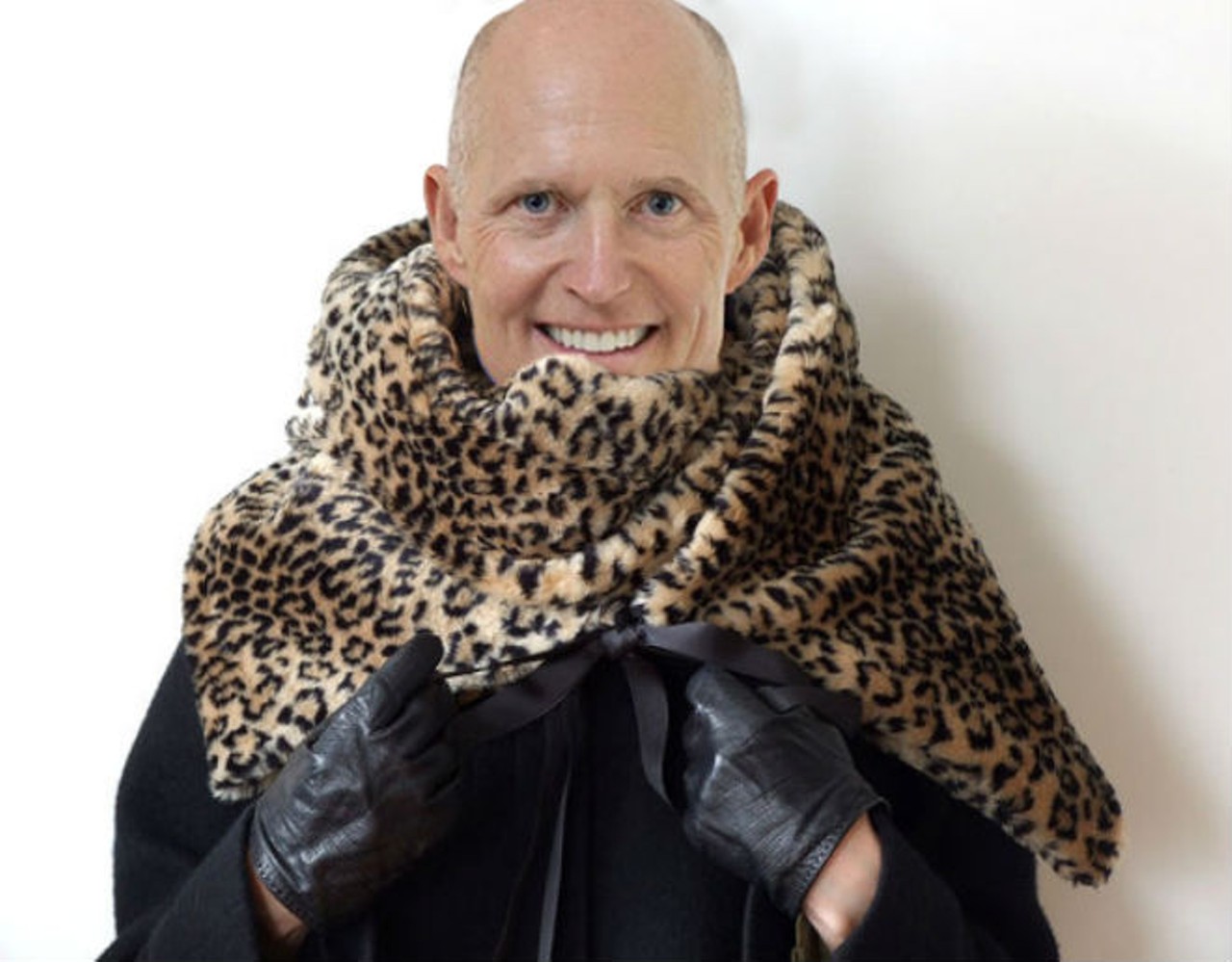 Rick Scott draped in a Florida panther skin
Since the state of Florida is trying it's hardest to remove our state animal, the panther, from the federally protected endangered species list why not fully embrace this idiocy by going out as our governor in a fabulous panther shawl? Or...