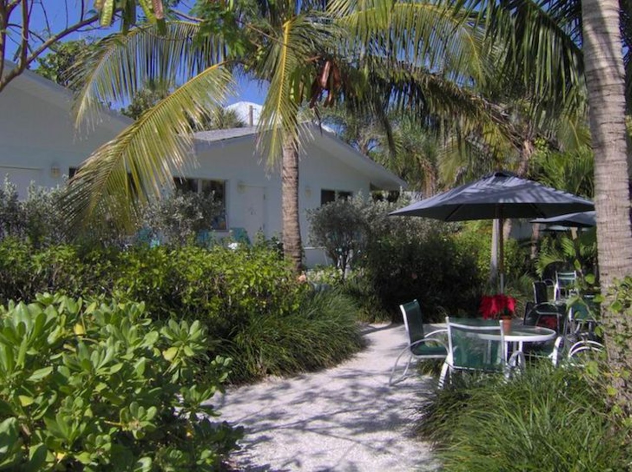 Blue Dolphin Cottages 
4227 West Gulf Drive, Sanibel Island, 239-472-1600
Estimated drive time from Orlando: About 4 hours
Cost per night: $129-$299 
Be careful about taking a stroll down the beach, unless you want to come back with pockets full of beautiful sea shells. The Blue Dolphin property is secluded and affords a picturesque view of the crashing waves and local flora and fauna. With the complimentary bicycles, guests can get around easily and take a dip in the Gulf of Mexico, relax on the shaded lounge chairs, and cook out on the grills. 
Photo via bluedolphincottages.com