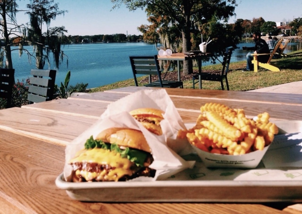 Shake Shack
119 N. Orlando Ave., Winter Park
Shake Shack might not be your first thought when it comes to scenic patio dining. But this location, located right on the edge of Lake Killarney, is a prime spot to down a burger and pretend you're on a lakeside vacation. FWIW, this is also the very first outpost of the New York City-based chain to open in Central Florida. And the prices aren't half bad, either.