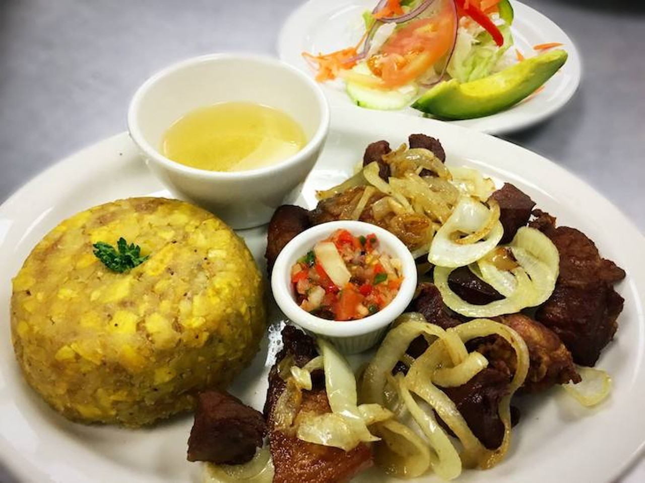Mi Viejo San Juan Restaurant 
7229 E. Colonial Drive, 407-380-2061
Straight-up Puerto Rican meat & seafood dishes delivered in an intimate, family-run environment. They offer a soup of the day, and some of their specialities include: chuleta can can (which is a rib/pork chop), mofongo seasoned in house condiments, fried red snapper, and their Mariscada, a seafood salad of conch, octopus and shrimp. The staff says they work for your praise and aims to make sure your experience is flawless. They have a great reputation for bringing the authentic flavor and atmosphere that takes us back to the island.
Photo via Mi Viejo San Juan/MiViejoSanJuanRest.com