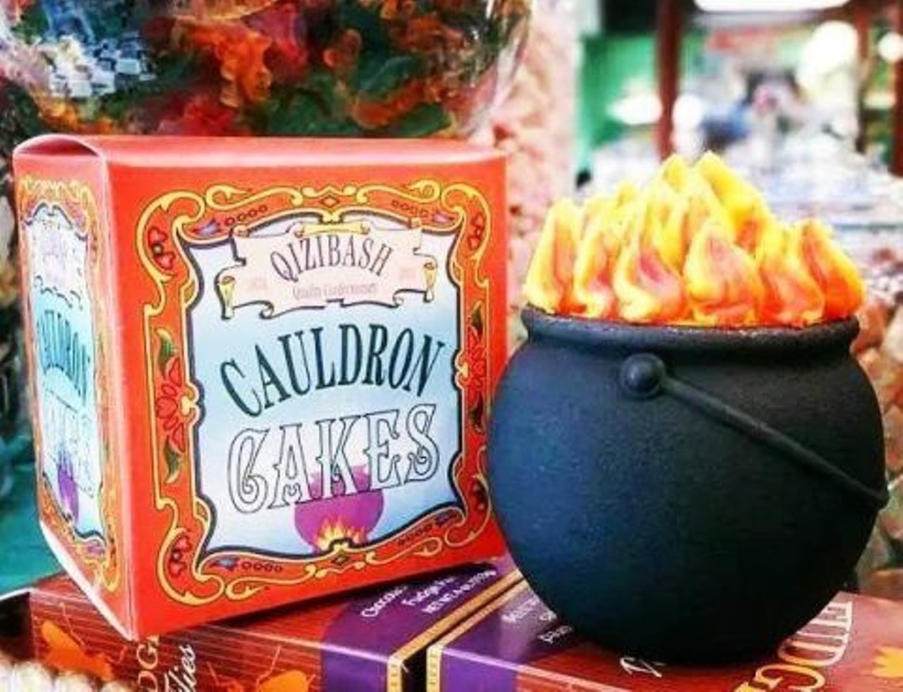 Cauldron Cakes 
Honeydukes, The Wizarding World of Harry Potter
This chocolate cake, topped with an orange and yellow buttercream flaming frosting, is served in a black reusable cauldron and was recently upgraded. The upgrade, which definitely made the cake tastier and added the cauldron, did drive the price up quite a bit though; from $3.95 to $9.95. The box even encourages those who bought the cake to make their own cauldron cake and reuse the cauldron itself. This moist cake can be found at Honeydukes and Sugarplum&#146;s.
Photo via Caldron Cakes/Delish