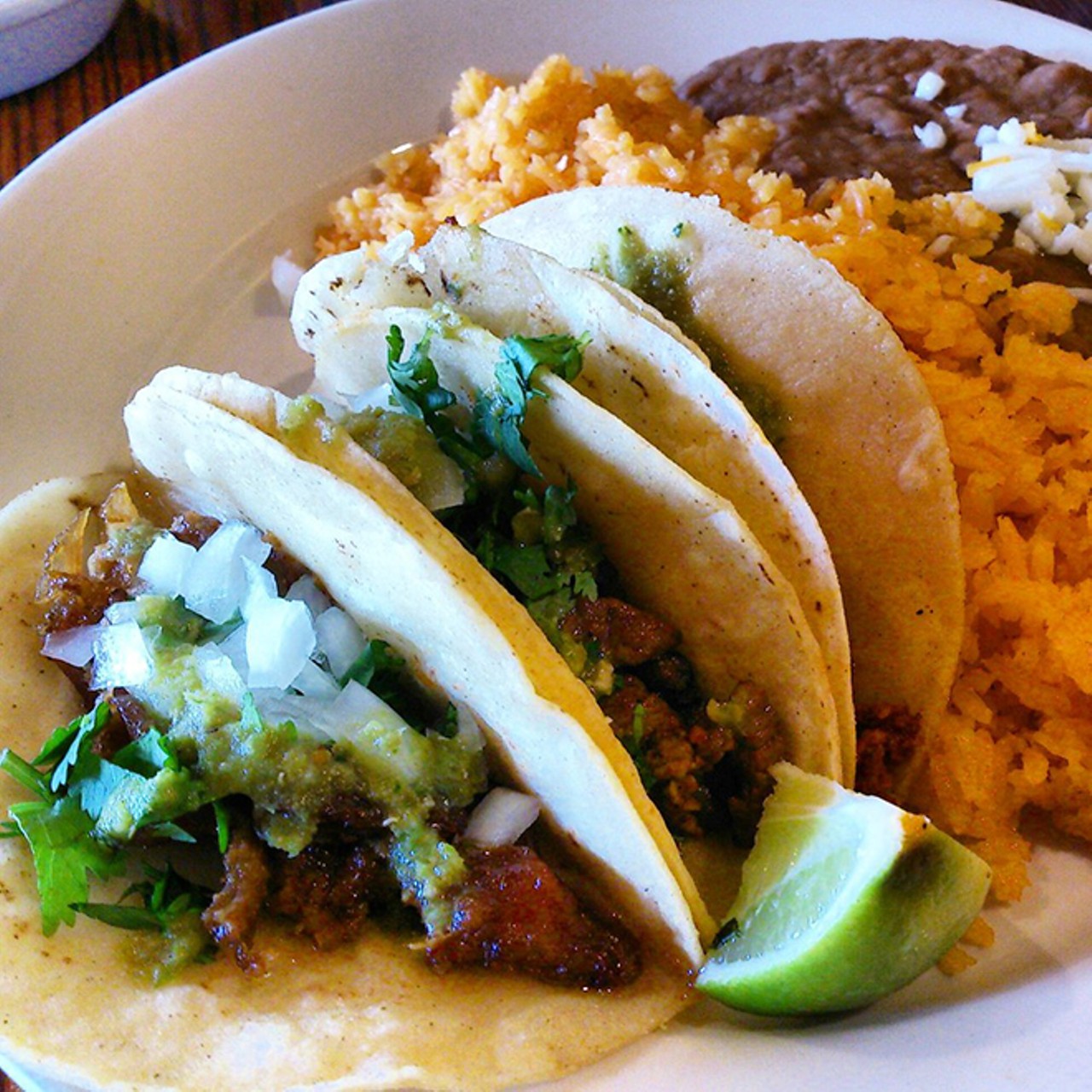 Border Grill
5695-A Vineland Road, 407-352-0101
To add some interesting flavor to their al pastor tacos (marinated pork), Border Grill puts some cilantro and onion. Each meal comes with a healthy dosage of rice and beans, so show up hungry.
Photo via Yelp
