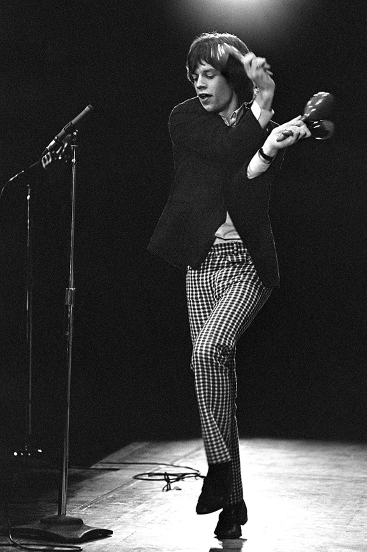 Mick Jagger With Maracas, Fourth U.S. Tour, 1965 #1
Mick Jagger, wearing some hypnotizing pants, was captured at the perfect moment in this photo by Bob Bonis in mid-step on stage, shaking his maracas during a performance of the Stones&#146; first U.S. single, &#147;Not Fade Away,&#148; originally recorded by Buddy Holly and the Crickets.