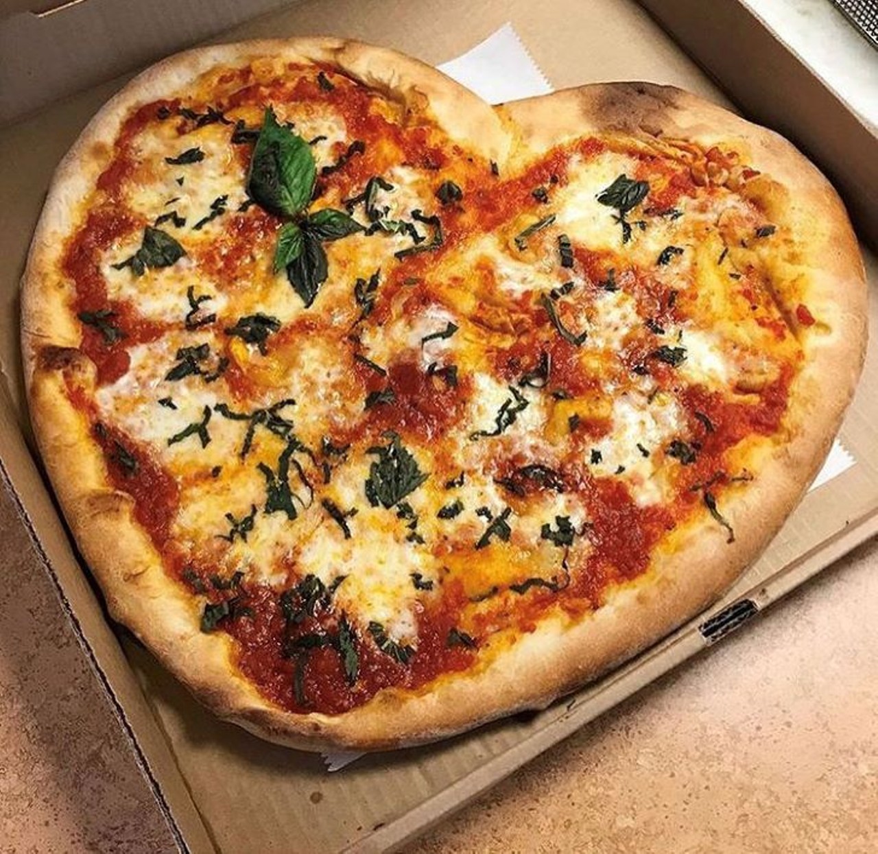 Pizzeria Del-Dio 
3210 E. Colonial Drive
Del-Dio&#146;s heart-shaped pizza is a simply perfect way to spend your Valentine Day in -- just add wine!
Photo via Pizzeria Del-Dio/ Instagram