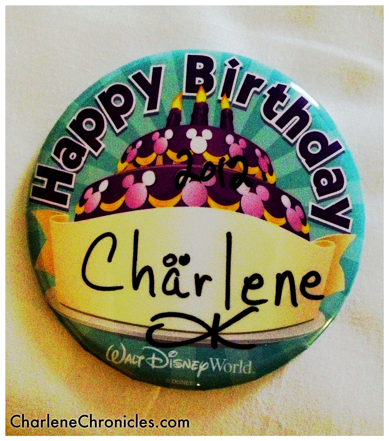 Disney gives away free birthday swag, such as this glorious pin.