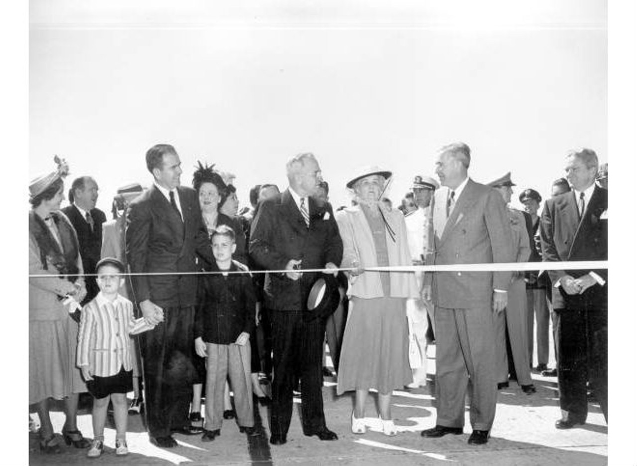 President Truman cutting ribbon at the dedication of the Charles O. Andrews bridge