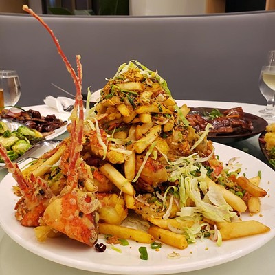 Seafood tower, YH Seafood ClubhouseIt's truly hard not to salivate over the soaring salvers of seafood proffered at YH, and it's damn near impossible to not genuinely enjoy indulging in a platter of fried lobster piled high with french fries, fried scallions, chilies and garlic.