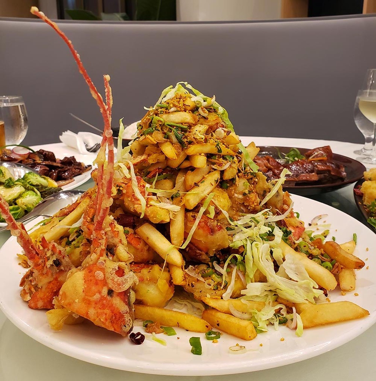 
Seafood tower, YH Seafood Clubhouse
It's truly hard not to salivate over the soaring salvers of seafood proffered at YH, and it's damn near impossible to not genuinely enjoy indulging in a platter of fried lobster piled high with french fries, fried scallions, chilies and garlic.
