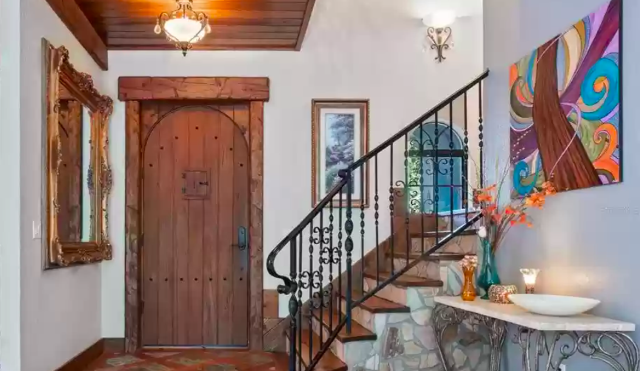 A woodsy castle on Orlando's Lake Mary Jane just hit the market