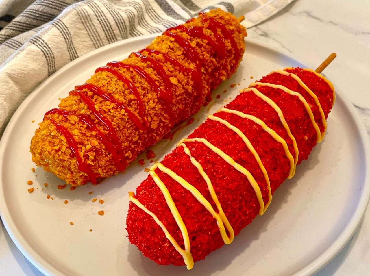 Spicy Korean Corndog
Hot dog dipped in buttermilk batter, layered with cheese, and rolled in crushed spicy hot Cheetos.
Location: Seivers Smokehouse Grill