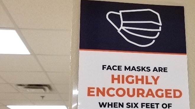 A sign at Eccleston Elementary School says masks are recommended, not required.