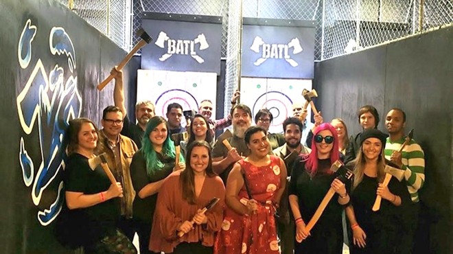 A happier, larger Orlando Weekly staff at last year's holiday party. Actually, throwing axes might be a great stress reliever right now ...