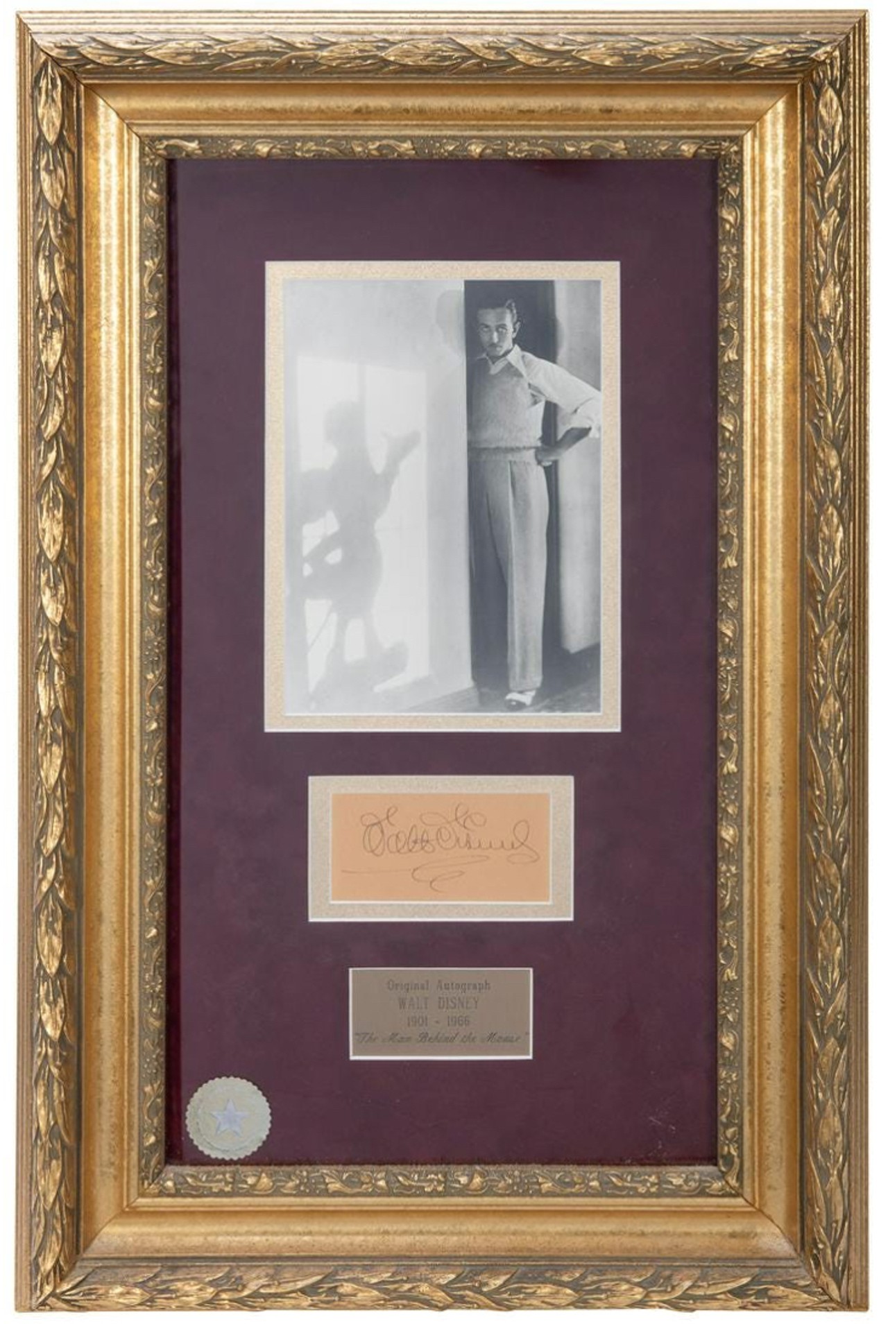 A framed Walt Disney autograph
Estimated sale price: $800-1200
This 27-&frac12; x 18&#148; piece includes a clipped signature, a photo, and a plaque. It has a CoA from Walt Disney World Co. affixed to the back of its frame.