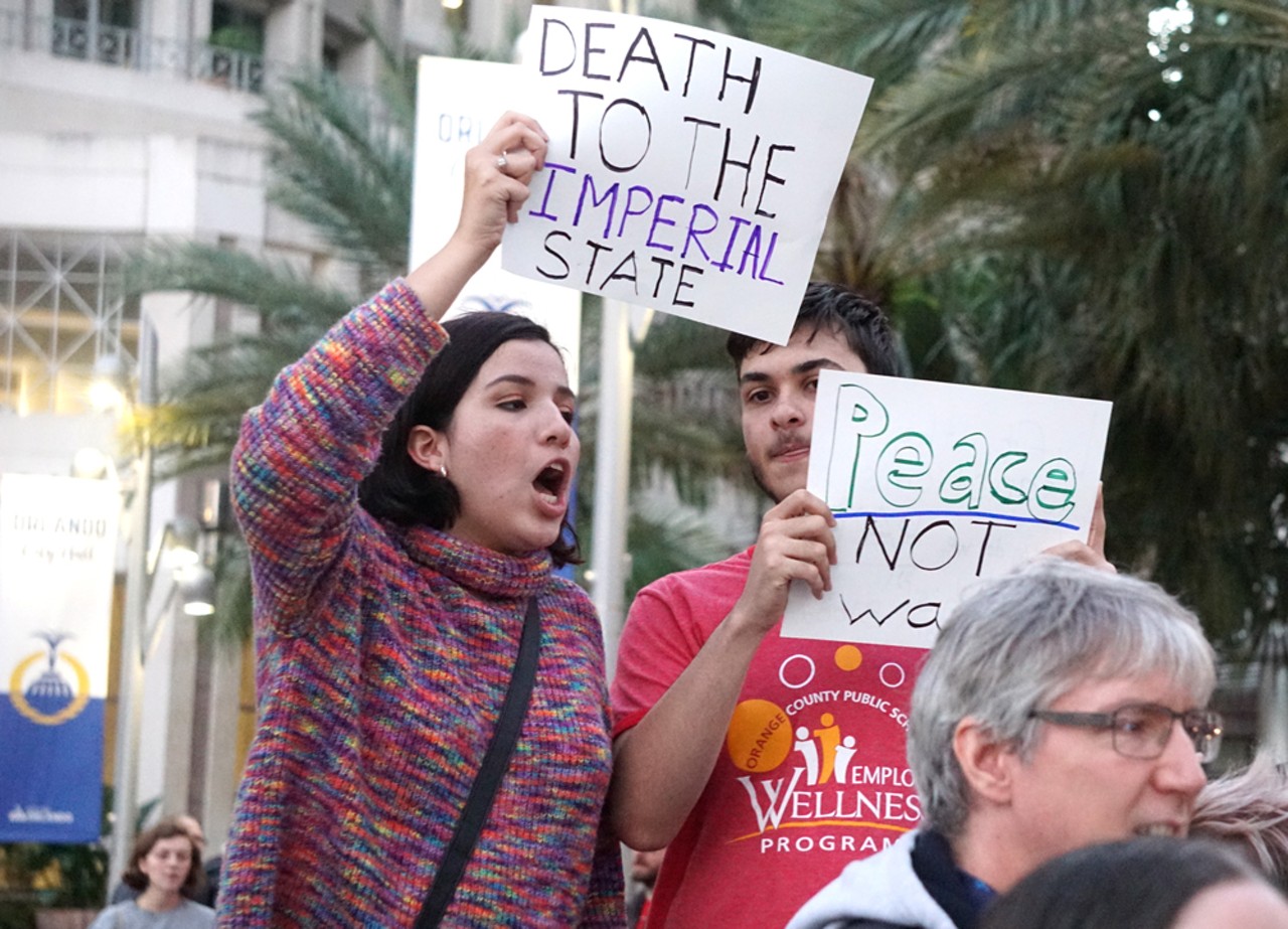 Everyone we saw and all the best signs from Orlando's 'No War with Iran' protest