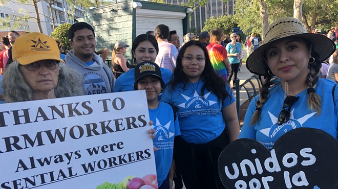 Organizers with the Farmworkers Association of Florida at the 'March for Our Dreams & Freedom' in downtown Orlando (May 1, 2023)