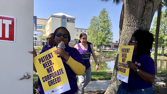 Employees of HCA Florida Osceola Hospital rally outside the hospital over understaffing, which they say is creating unsafe conditions for patients (May 10, 2023)
