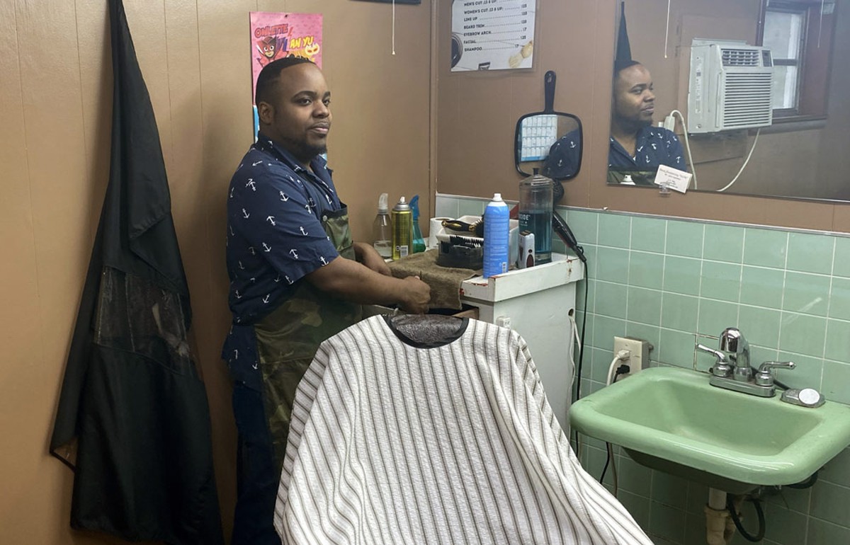 Kejana “Andrew” Miller at his barbershop Poetic Cuts, in High Springs, Florida. Miller, who serves as a High Springs city commissioner, has no criminal background but supports the change in legislation. (Feb. 23, 2024)